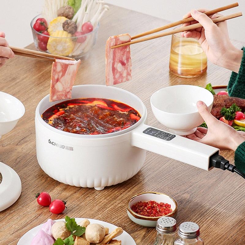 Panela elétrica multifuncional com regulador de tempo e temperatura.